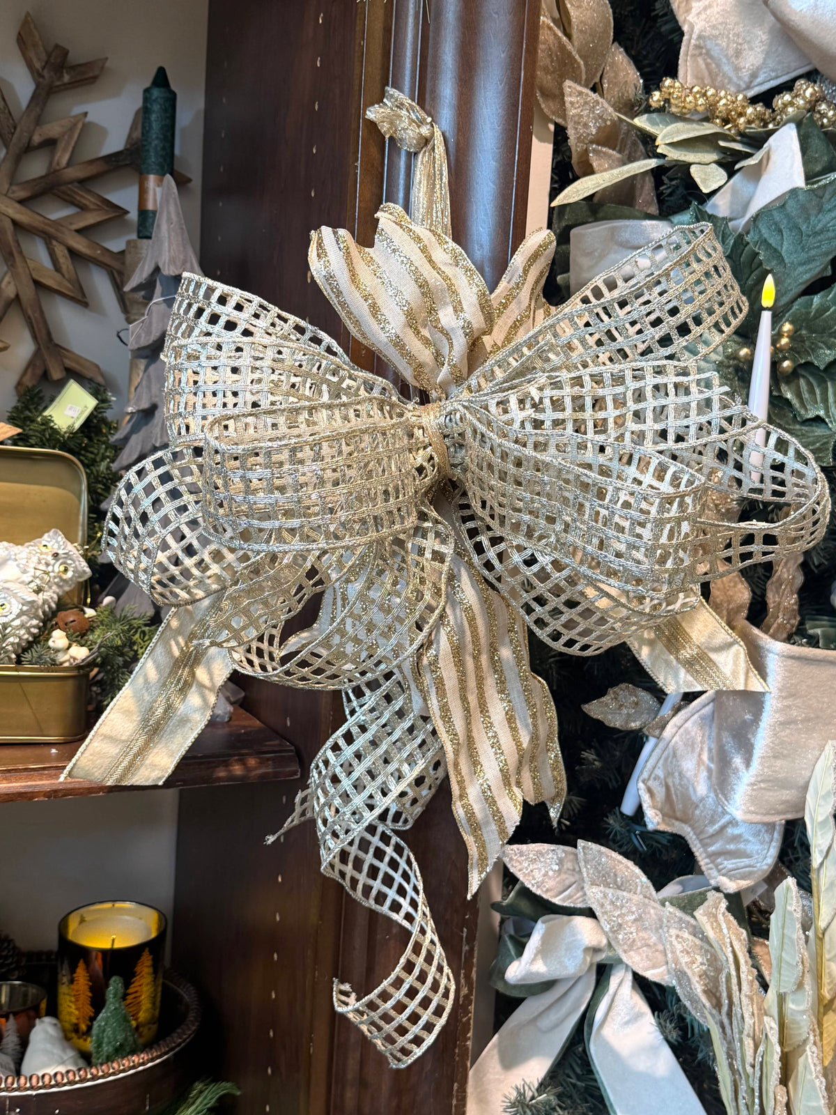 Large gold mesh wired ribbon bow with glitter stripe accents, holiday décor