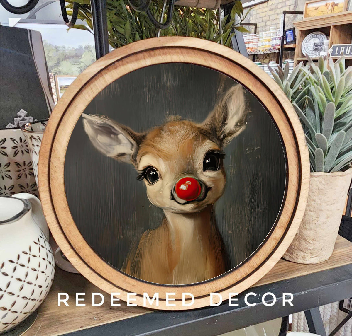 Round canvas print of Rudolph the red-nosed reindeer in wood frame, 8 inch