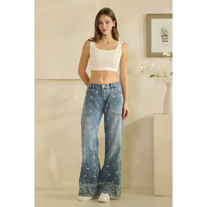 Wide-leg flare jeans with all-over paisley print and embroidered hem border