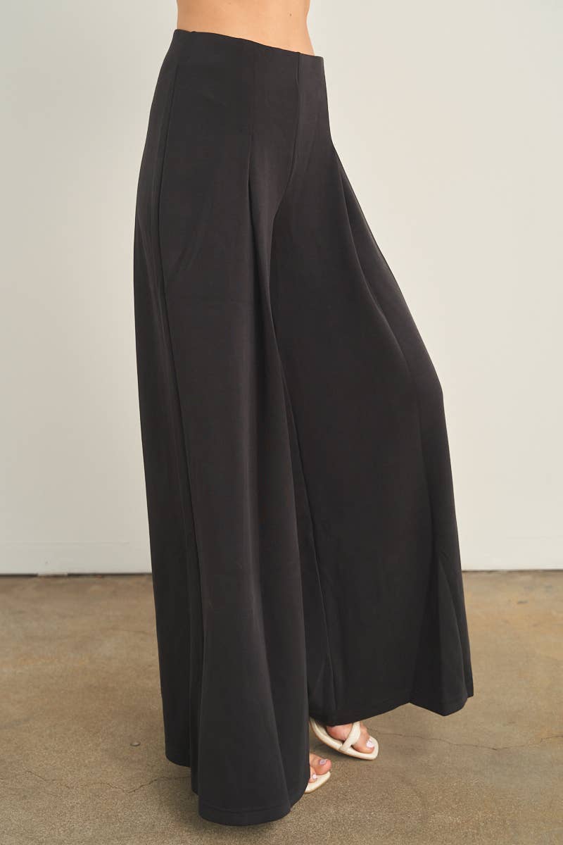 Black high-waist wide-leg palazzo pants with flowing silhouette, side view