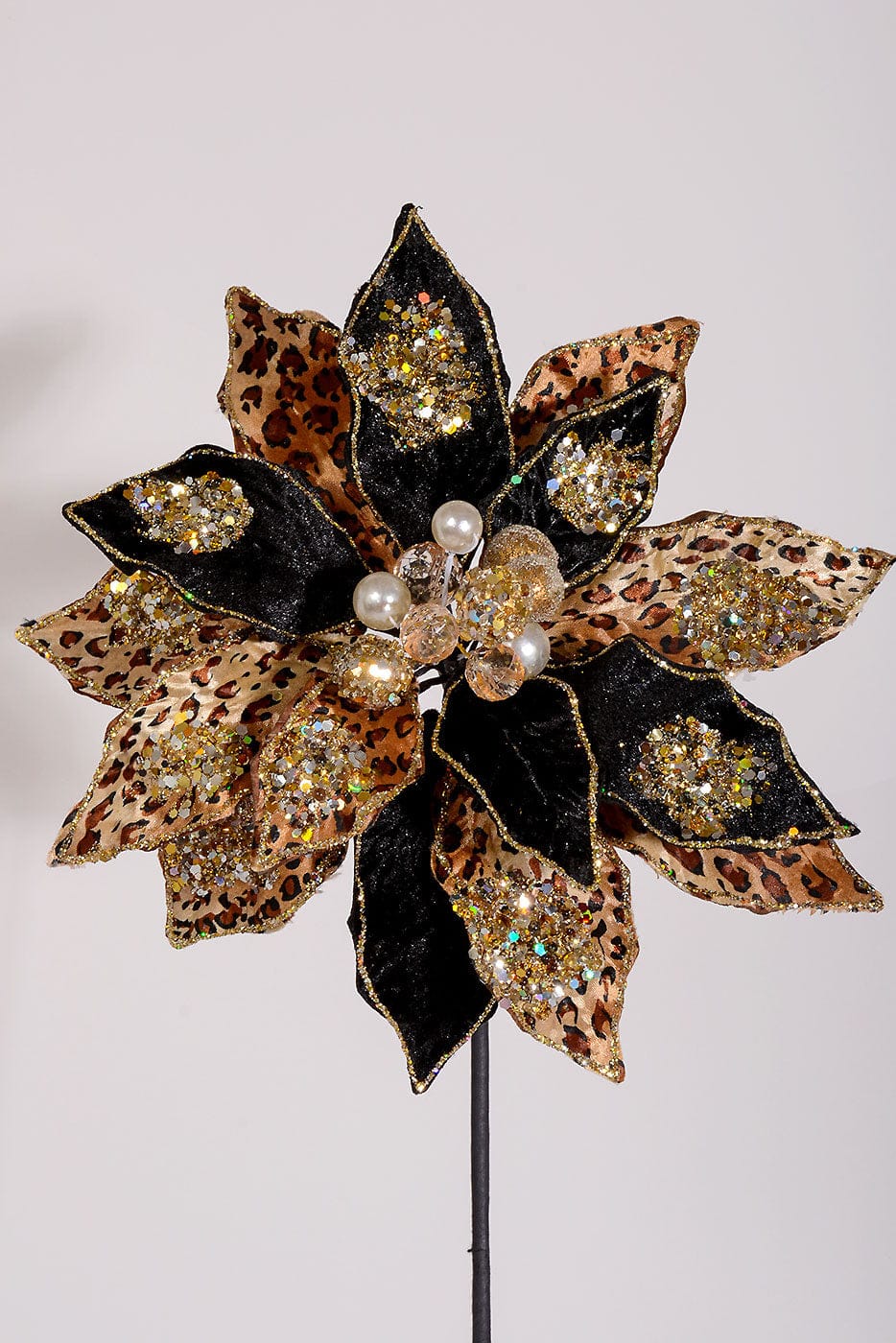 Large decorative poinsettia stem with black velvet and leopard print petals, gold glitter accents, and pearl center