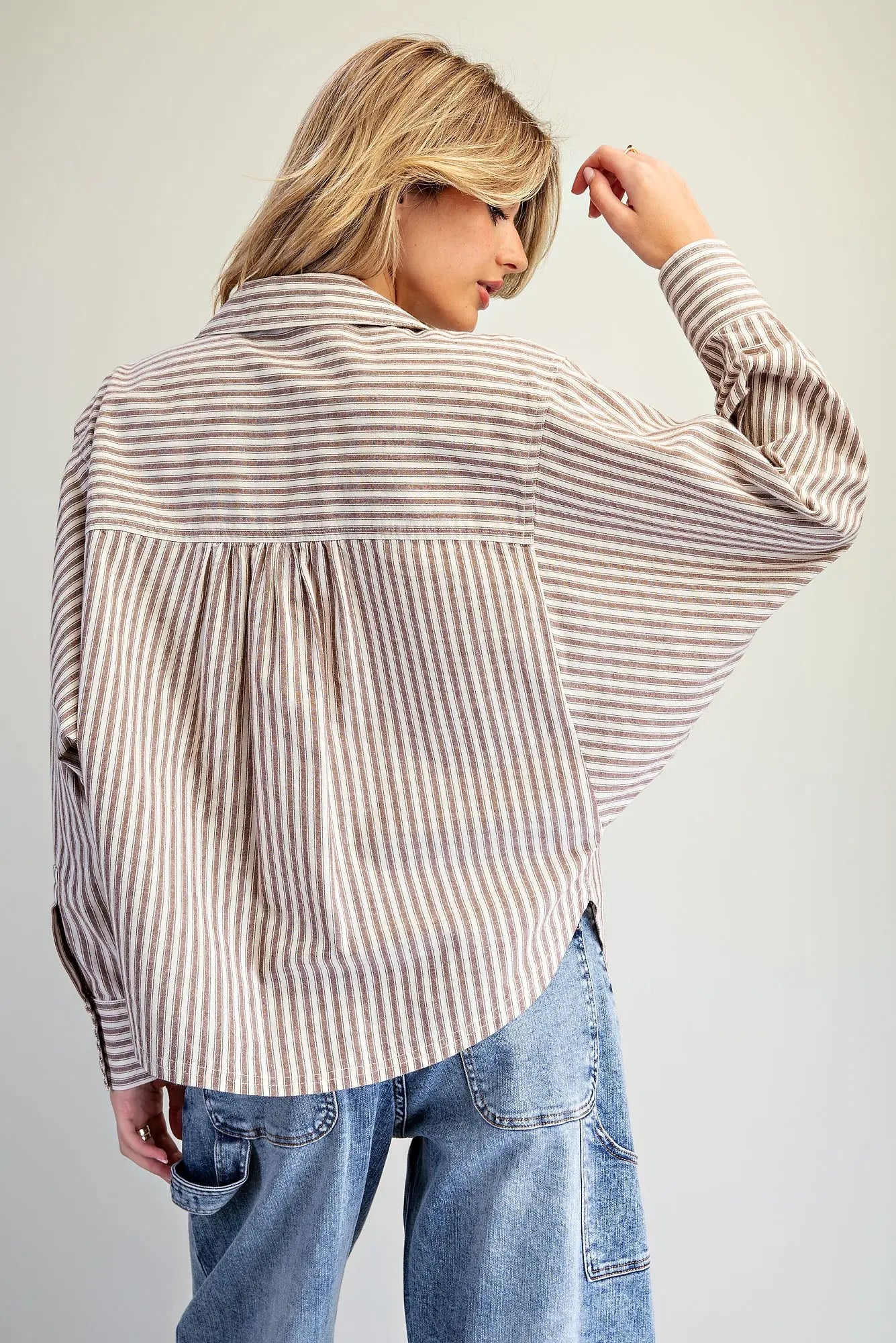 Brown and white striped dolman sleeve button-down blouse, back view