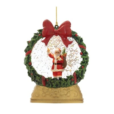 LED Santa snow globe ornament with holly wreath frame and red bow, 5 inches tall
