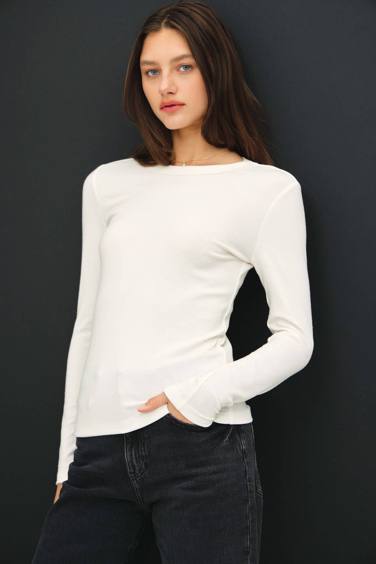 Be Cool white round neck long sleeve fitted knit top with dark jeans