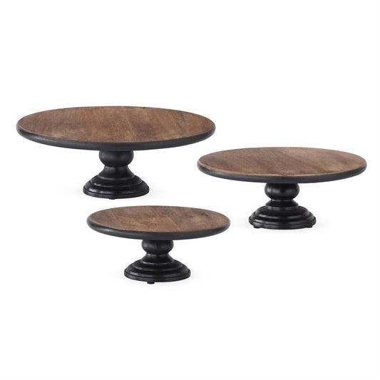 Set of three round wood cake stands with black pedestal bases in small medium large sizes