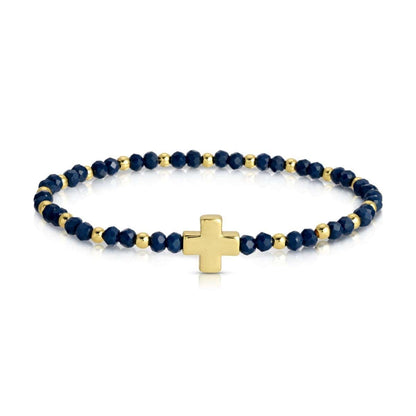 Navy blue crystal stretch bracelet with gold beads and gold cross centerpiece