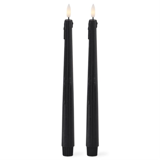 Set of two black LED drip taper candles with warm white flickering flame tips