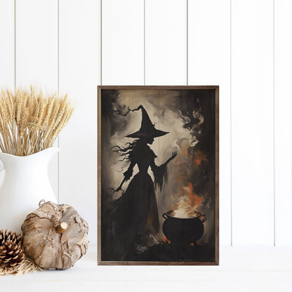 Framed witch silhouette wall art with cauldron, dark moody Halloween décor on wood panel