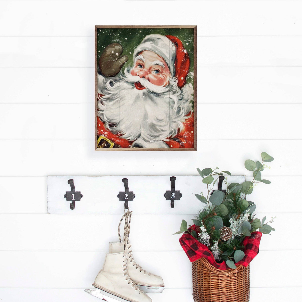 Framed vintage Santa Claus wall art print on white shiplap wall with green background