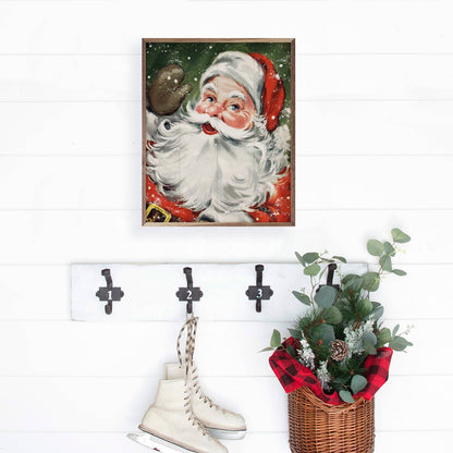 Framed vintage Santa Claus wall art print on white shiplap wall with green background