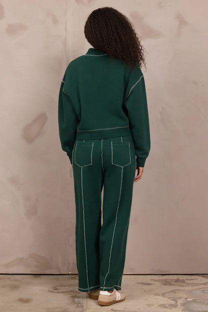 Forest green mockneck sweatshirt with contrast white stitching, back view