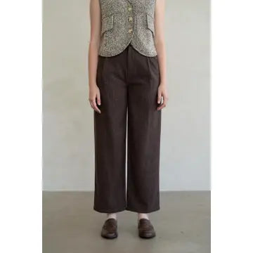 Wide leg dark brown textured tailored trousers with relaxed fit and cropped length