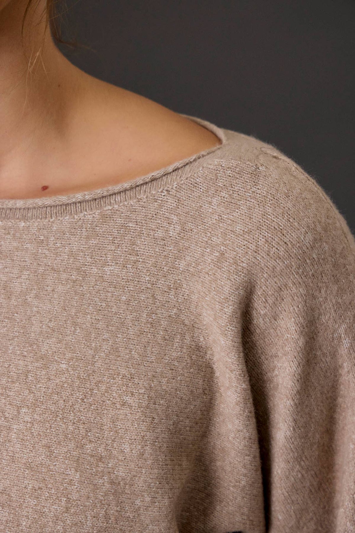 Ultra soft heathered taupe boat neck knit sweater, close-up shoulder detail