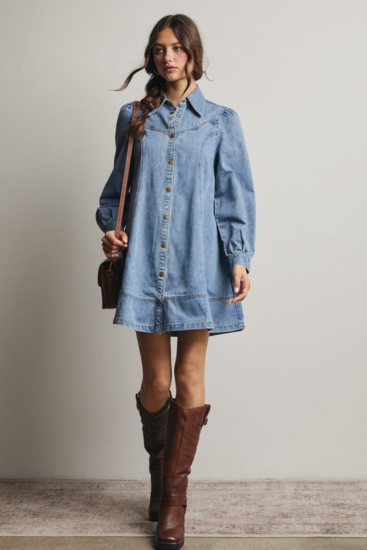 Light wash denim mini shirt dress with snap buttons, puff sleeves, and Western yoke detailing