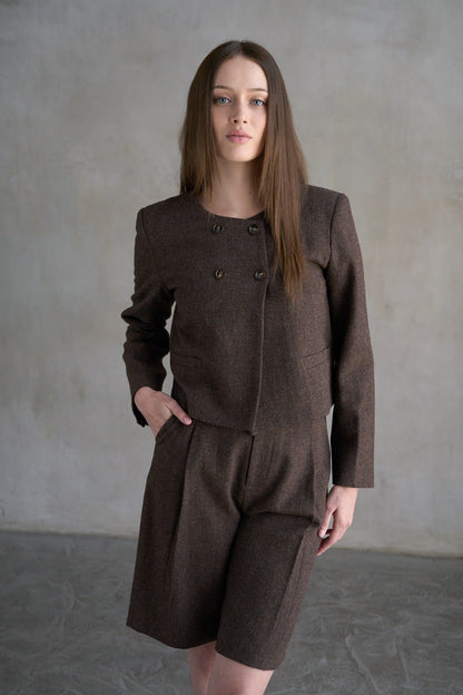 Women's dark brown houndstooth collarless cropped jacket with double buttons and welt pockets