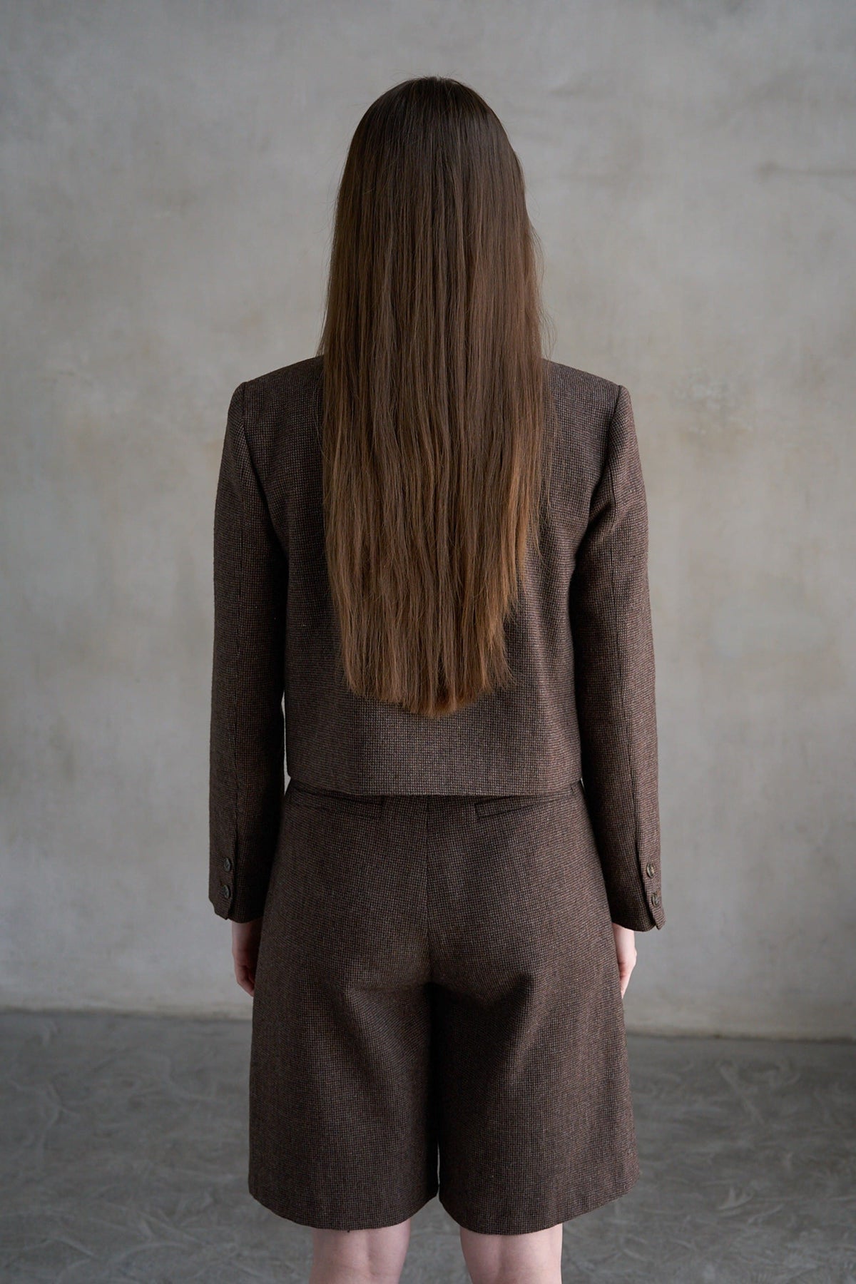 Brown houndstooth cropped collarless blazer and matching shorts set, back view
