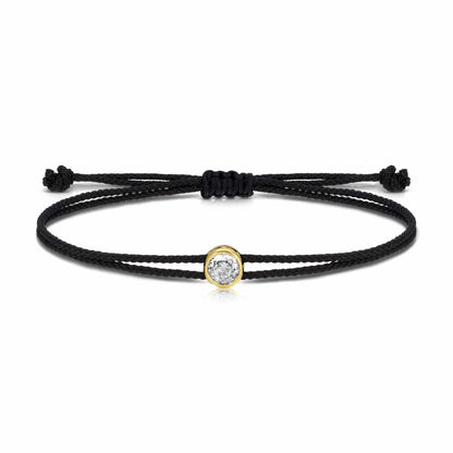 Black cord adjustable slider bracelet with gold bezel oval crystal charm