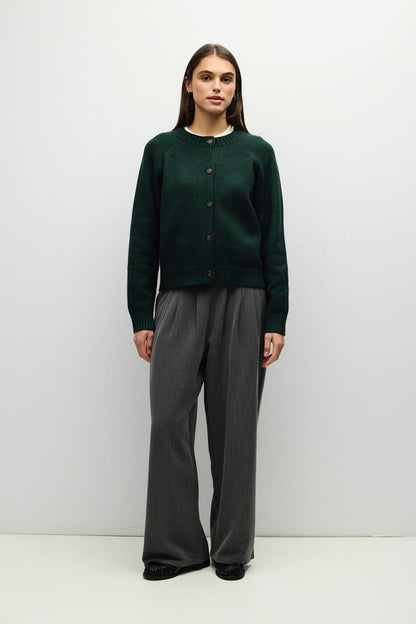 Cropped dark green button-front knit cardigan with ribbed trim and raglan sleeves