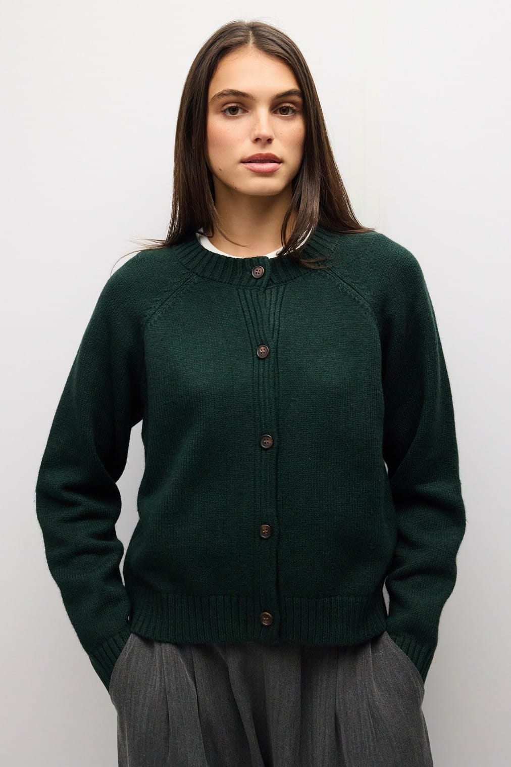 Hunter green button-front knit cardigan with crew neck and raglan sleeves