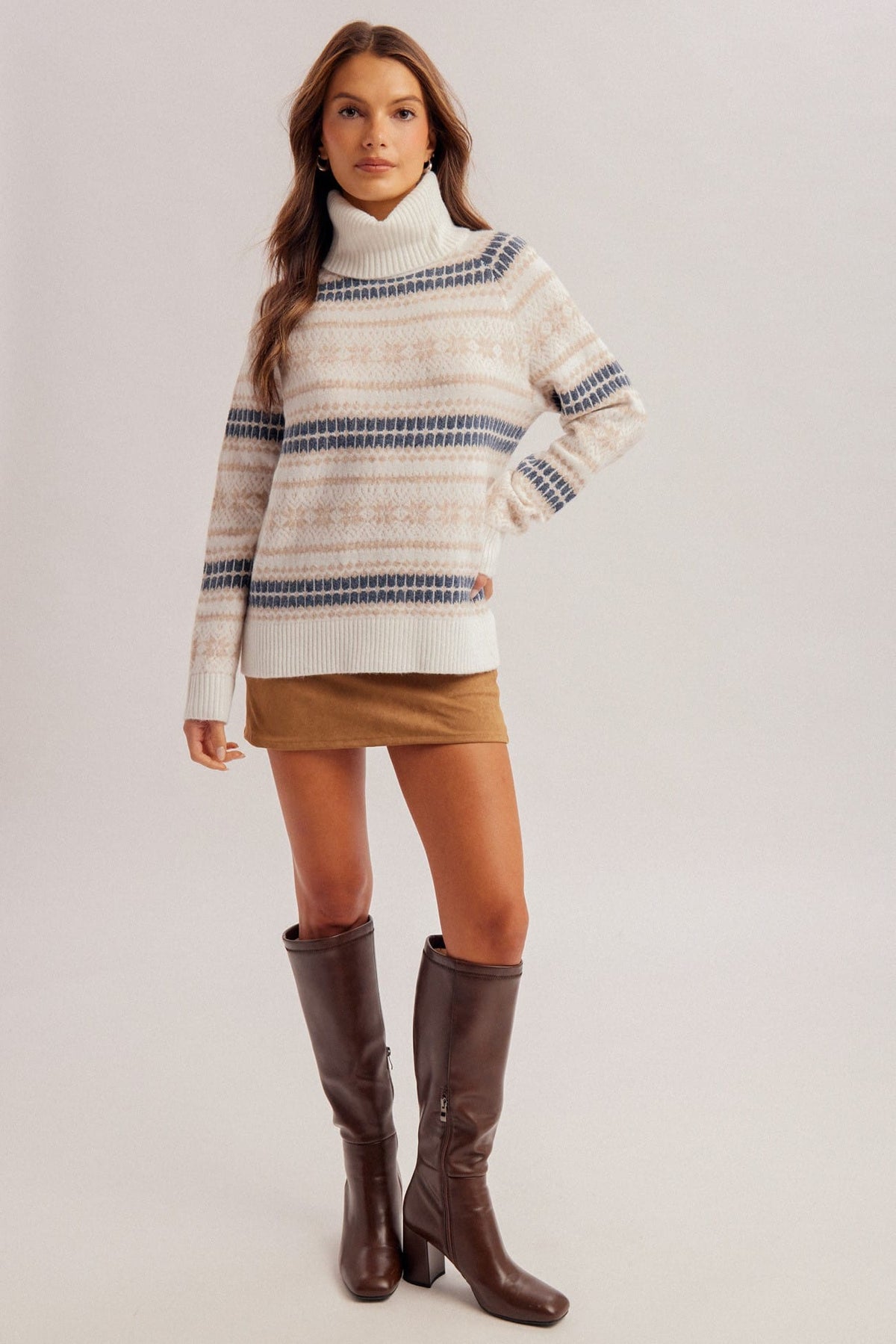 Cream Fair Isle turtleneck sweater with blue and tan stripe pattern