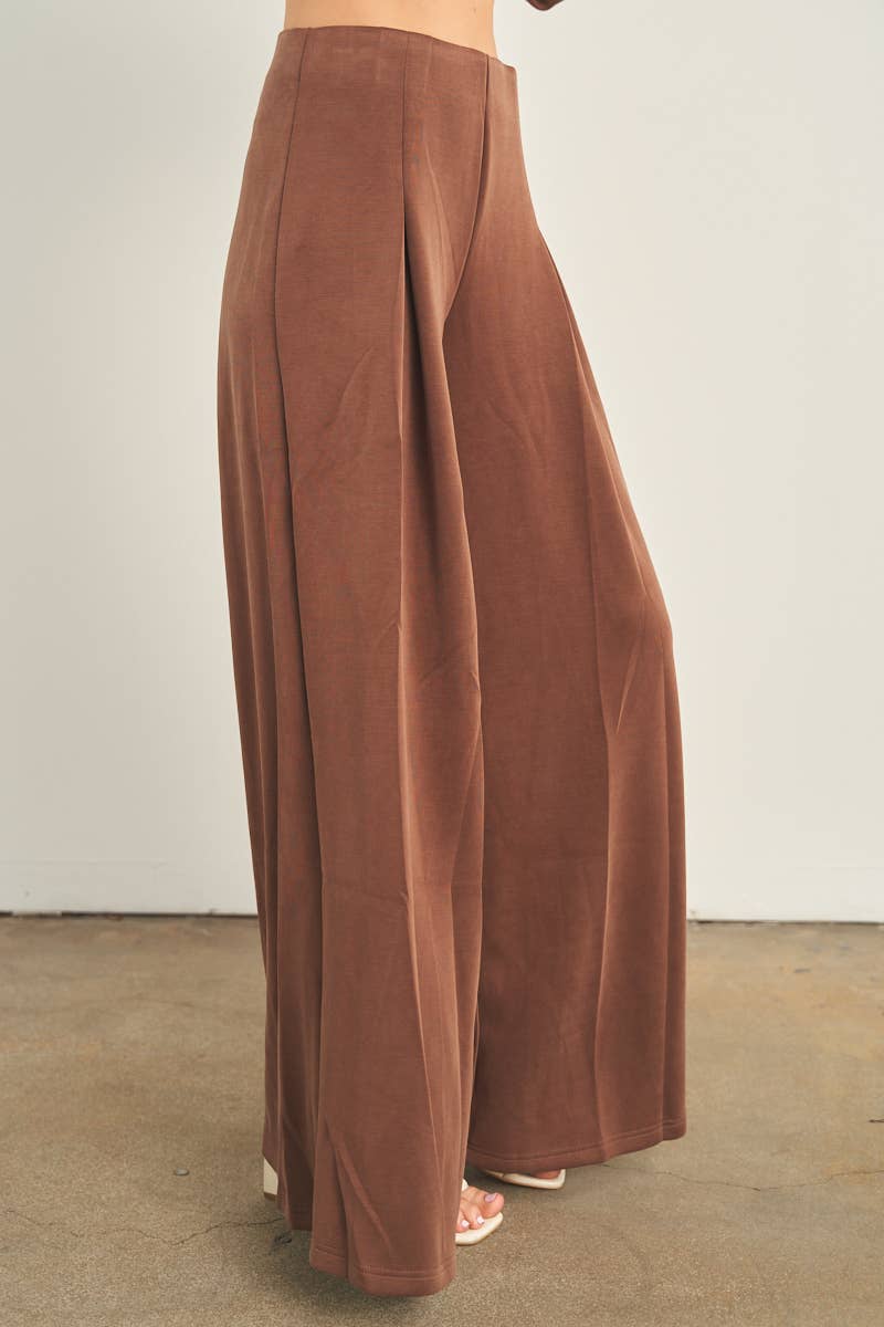 Brown wide-leg palazzo pants with high waist and front pleat detail