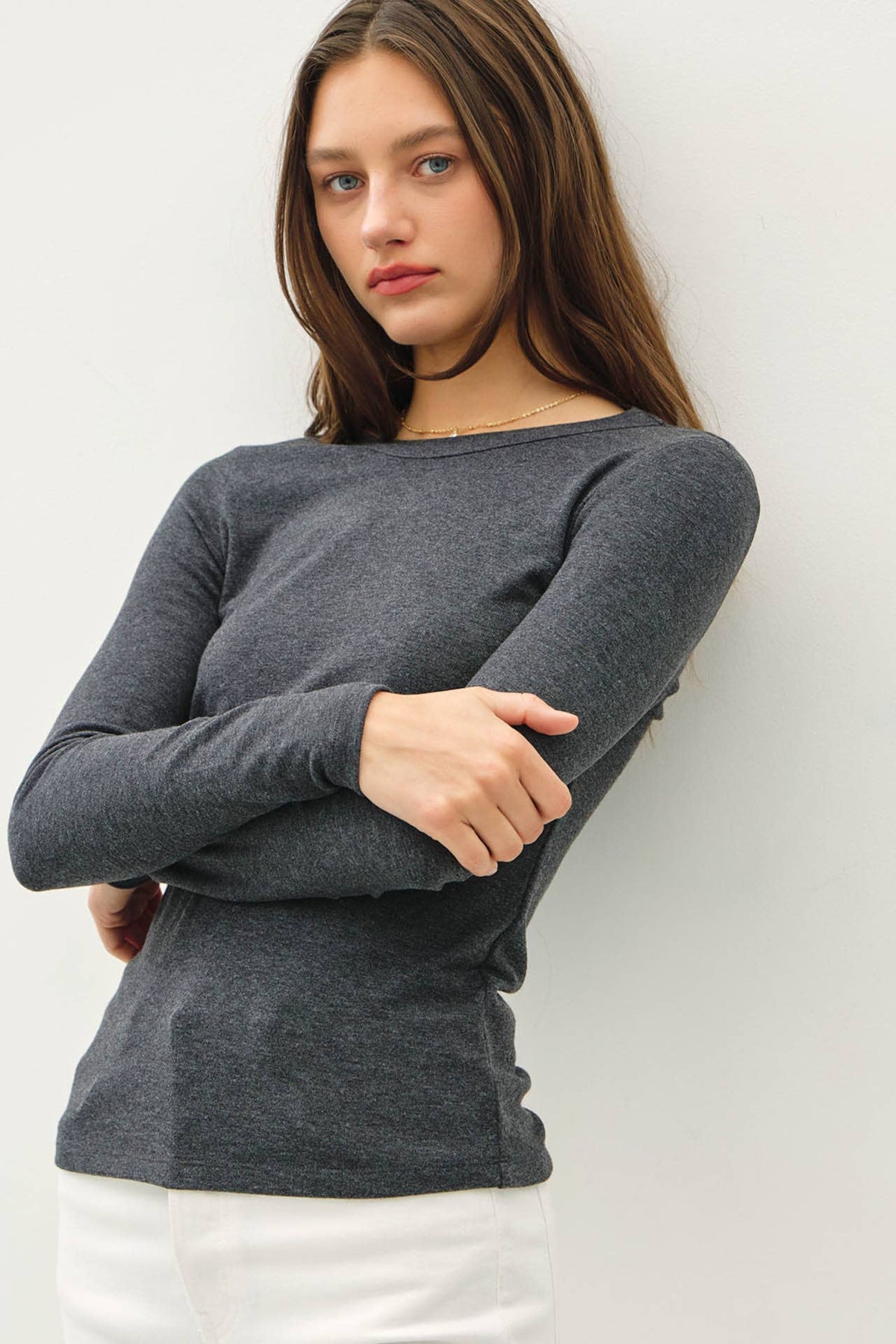 Be Cool charcoal gray round neck long sleeve fitted knit top on model