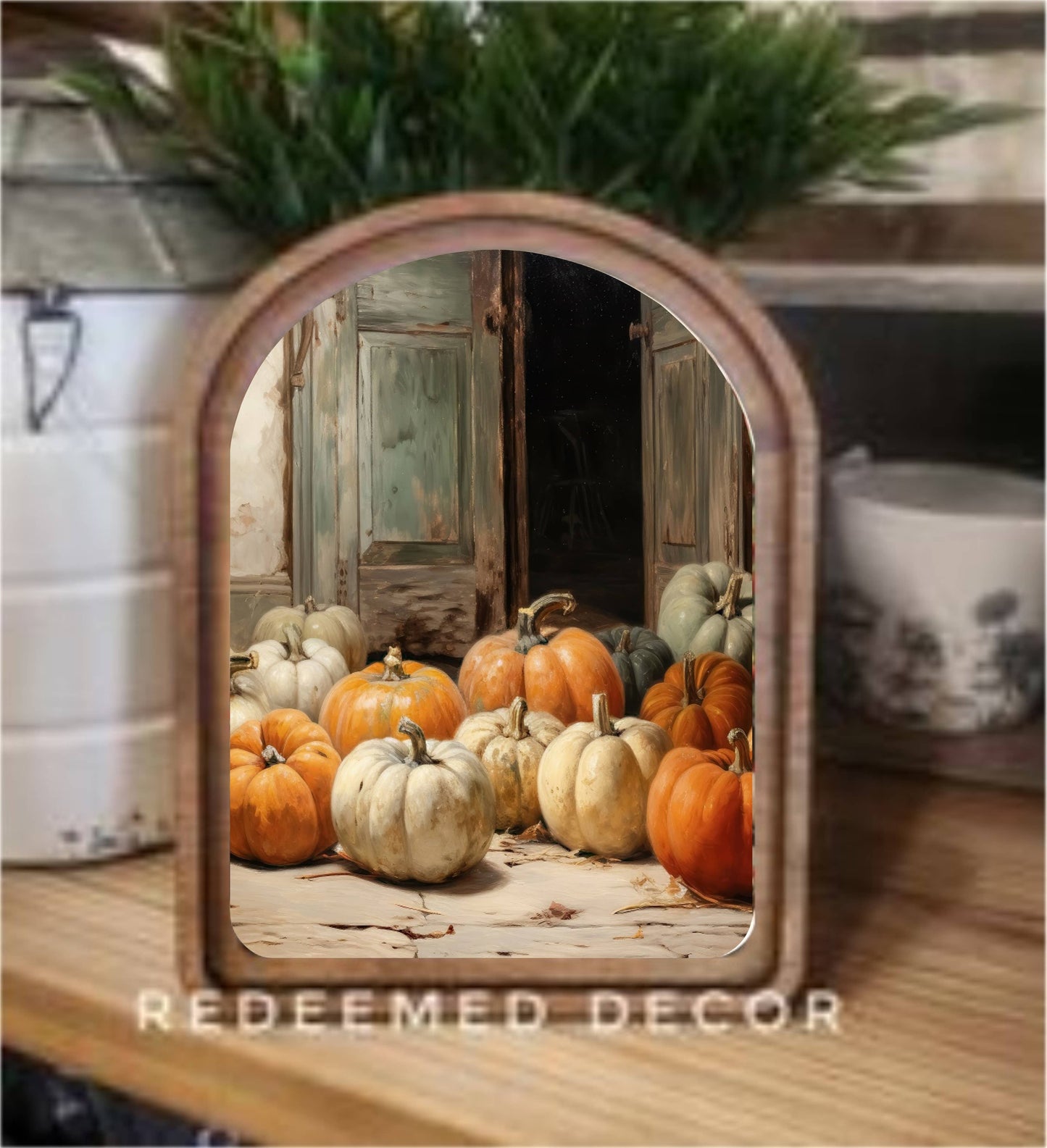 Arch-top wood framed canvas art featuring orange and white pumpkins at a rustic barn door