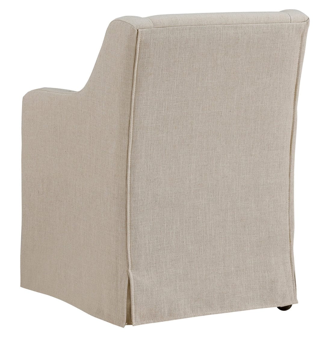 Barber cream linen slipcovered dining arm chair with casters, rear view