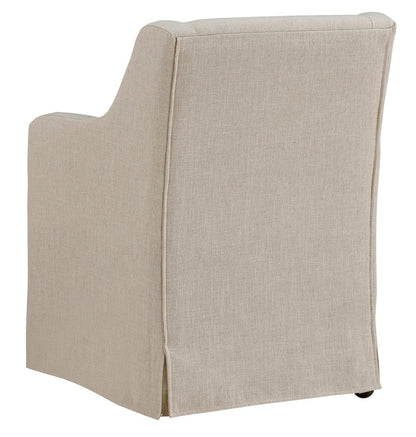 Barber cream linen slipcovered dining arm chair with casters, rear view