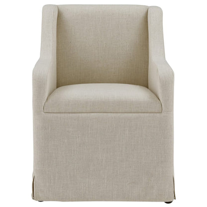 Forty West Barber beige linen upholstered dining armchair with skirted base on casters