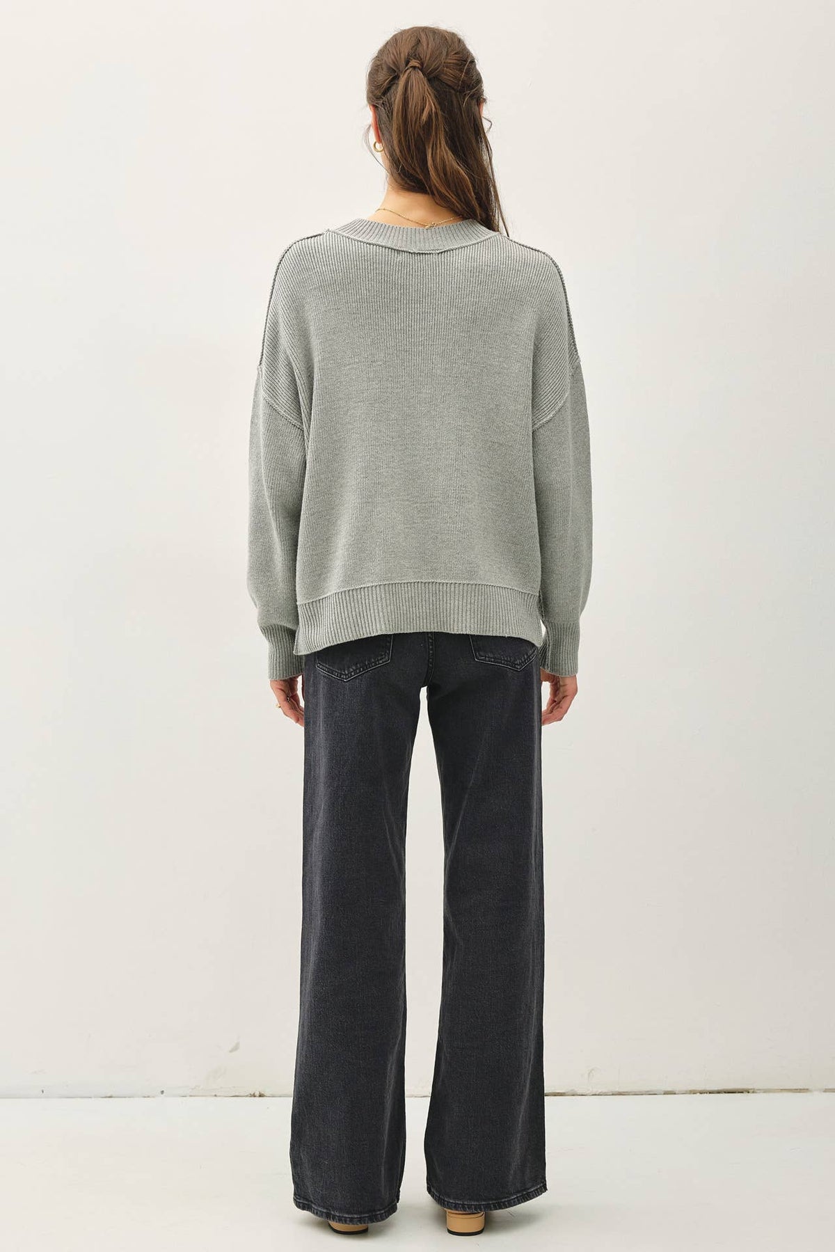 Relaxed sage green ribbed knit sweater with drop shoulders, back view