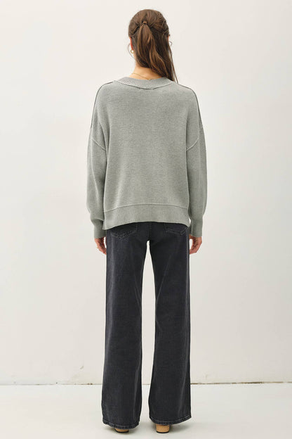 Relaxed sage green ribbed knit sweater with drop shoulders, back view