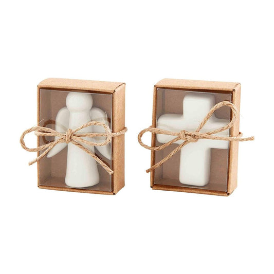 White ceramic angel and cross figurines in kraft boxes tied with twine bows