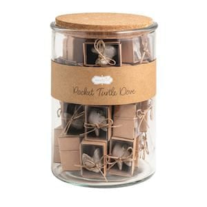 Glass jar with cork lid filled with miniature brown pocket turtledove gifts