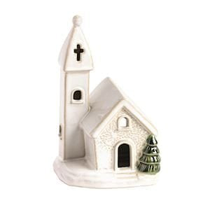 White ceramic church figurine with steeple, cross, and small green tree accent