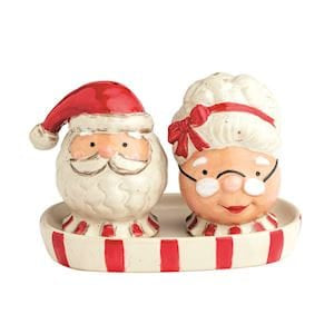 Ceramic Mr. and Mrs. Claus salt and pepper shakers on candy cane striped tray