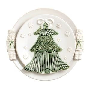 White ceramic Christmas tree platter with nutcracker handles and green tree relief detail