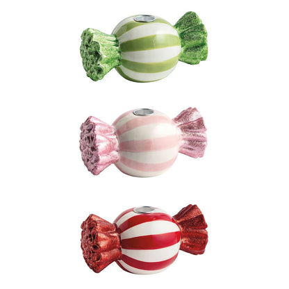 Ceramic candy-shaped taper holders in red, pink, and green stripes with glitter wrapper ends
