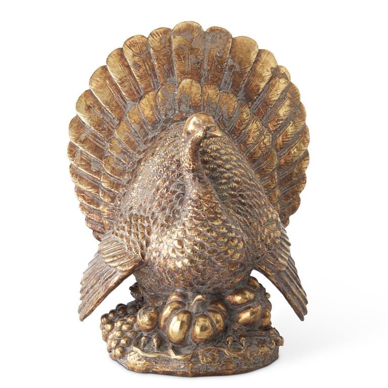 Antique gold resin turkey figurine with fanned tail feathers on decorative base