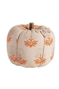 Cream fabric stuffed pumpkin with orange block print floral pattern and brown stem