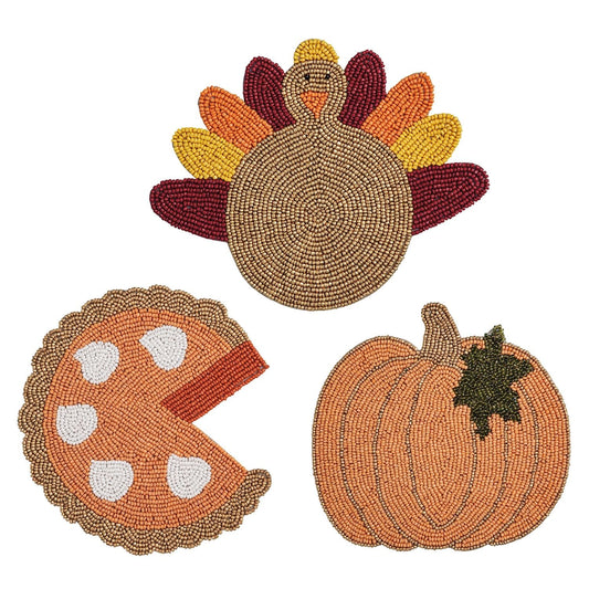 Set of three Thanksgiving beaded trivets shaped as turkey, pumpkin pie, and pumpkin