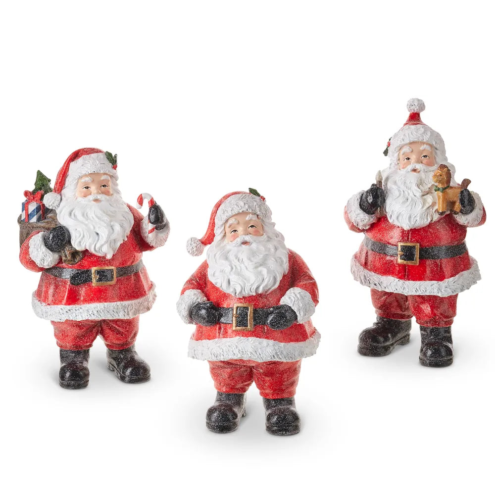 Set of three vintage-style red Santa Claus figurines holding holiday gifts and toys