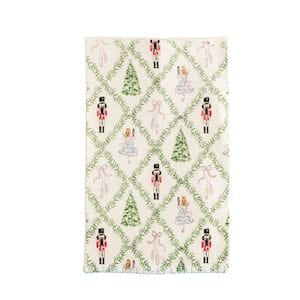 White cotton tea towel with nutcrackers, ballerinas, and Christmas trees pattern