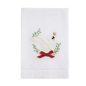 White linen hand towel with embroidered swan, greenery, and red bow