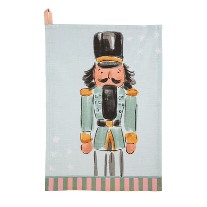 Mudpie light blue linen tea towel with illustrated nutcracker soldier and striped border