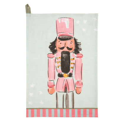 Mudpie pink nutcracker printed kitchen towel with mint background and striped border