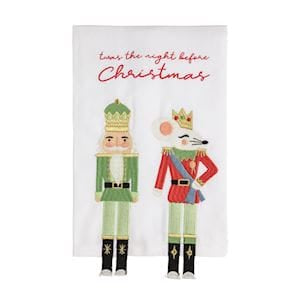 White kitchen towel with two embroidered nutcracker figures and Christmas script text