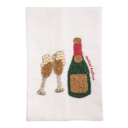 White beaded tea towel with champagne bottle and flutes reading festive