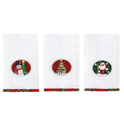 Set of three white Christmas kitchen towels with needlepoint snowman, tree, and Santa medallions
