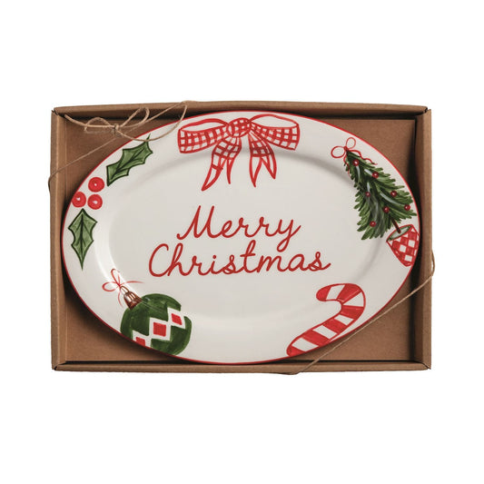 Oval ceramic Merry Christmas plate with holly, candy cane, and ornament motifs in gift box